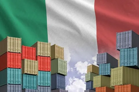 Italy flag and big stack of shipping cargo containers in docks with sky Stock Photos