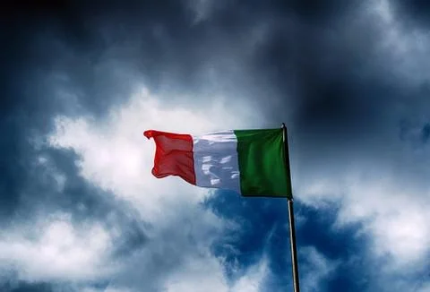 Italy flag and dramatic clouds. Stock Photos