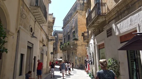 Italy, Lecce,  tourists in the historic center.  Stock Footage