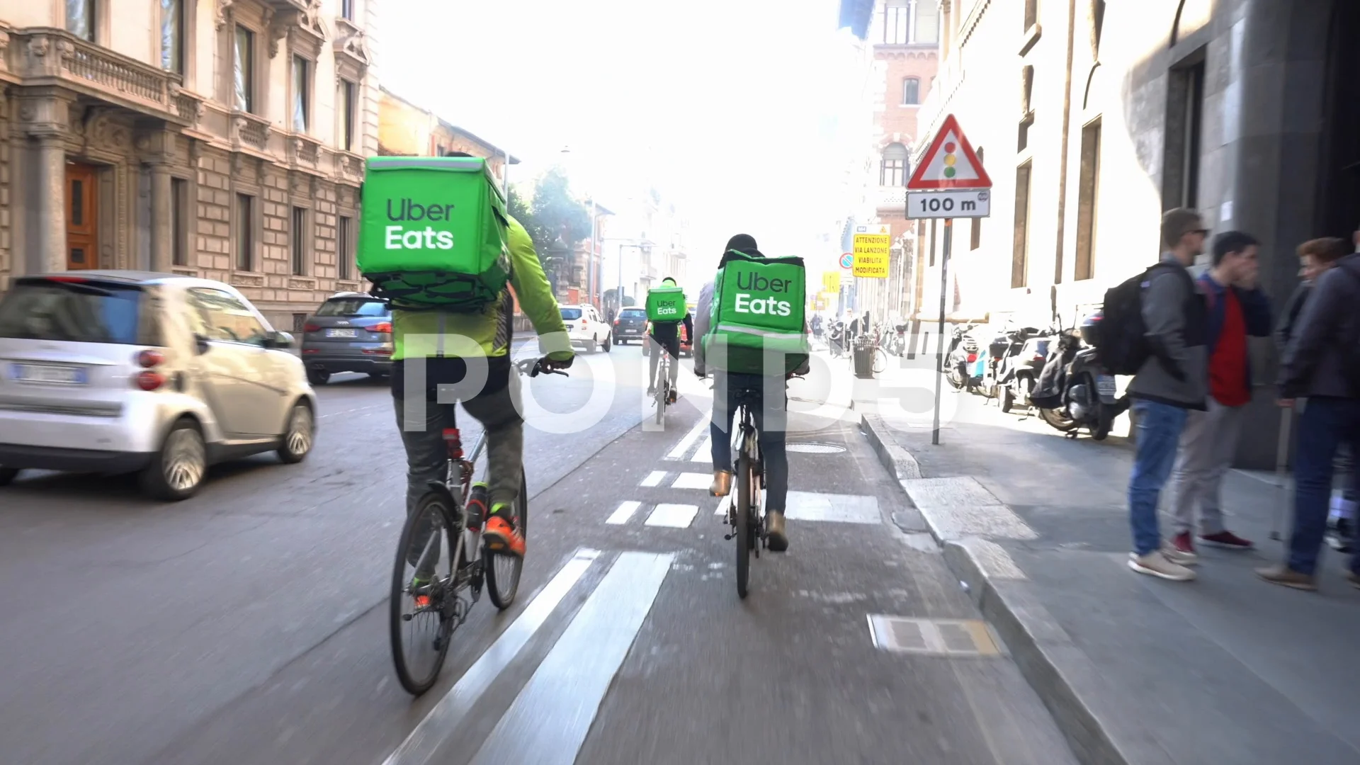 Italy , Milan January 21,2020 - Uber eats delivery food - bike driver going  in a