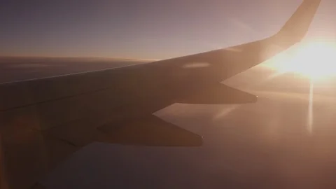 Italy package 17 | Light rays in airplane window sunset sunrise Video stock 115971932