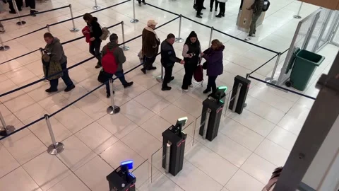 Italy Rome 12.13.2025 Passengers scanning boarding passes and lining up at Rome Stock Footage 323925853