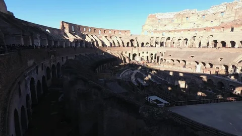 Italy, Rome, Coliseum: panoramic view of the inside arena on a sunny winter morn Stock Footage 100879010