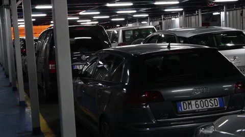 Italy to sicily messina ferry parked cars vehicles at night being transported Stock Footage 252151053