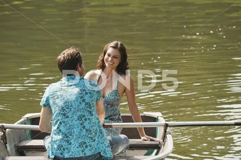 Italy, South Tyrol, Young Couple on a lake rowing Stock Photos