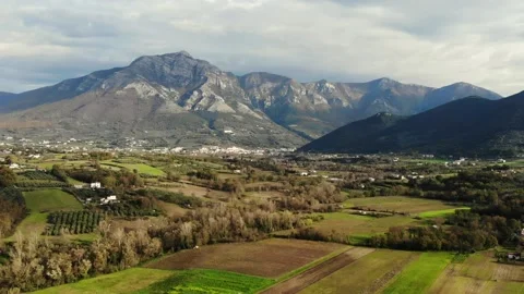 Italys Mountains behind field on cloudy day. Stock Footage 137780294