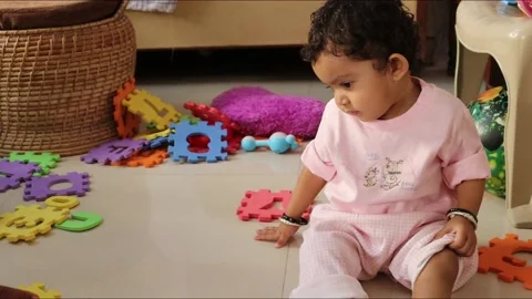 ITCHING IS DUSTURBING BABY WHILE PLAING Stock Footage 144466352