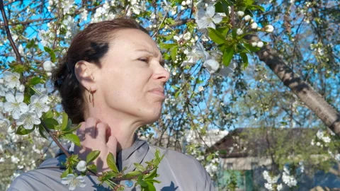 Itching lady by the tree. Stock Footage 333200122