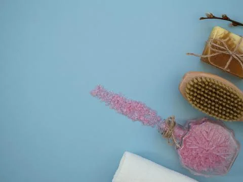Items and tools for home spa body skin care treatments on blue background with Stock Photos