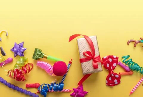 Items for carnival on yellow background. Stock Photos