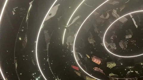 Items on display in round turning museum room on Louis Vuitton Exhibition in Video stock 317617835