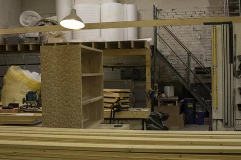 Items in garage. Workplace for creating structure. Production shop. Stock Photos