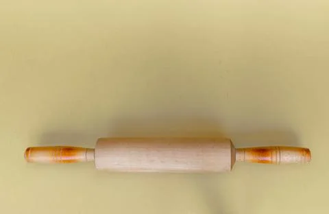 Items of kitchen utensils: a rolling pin, press for mashed potatoes, egg beater 스톡 사진