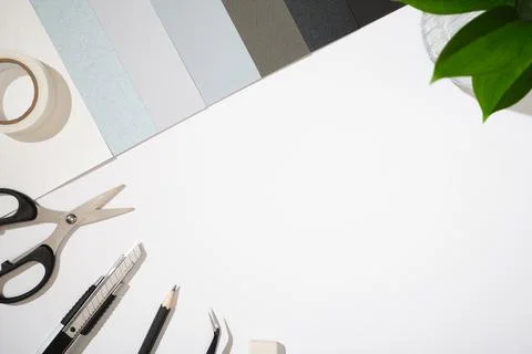 Items for paper craft hobby: scissors, craft knife, pencil, eraser, paper on  Photos