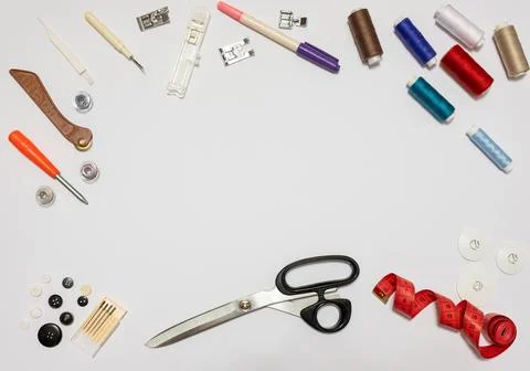 Items for sewing on a white background. Accessories for sewing and space for  Stock Photos