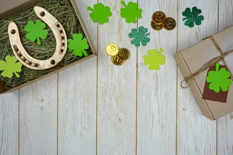 Items for St. Patrick's Day are laid out on a wooden background. Stock Photos