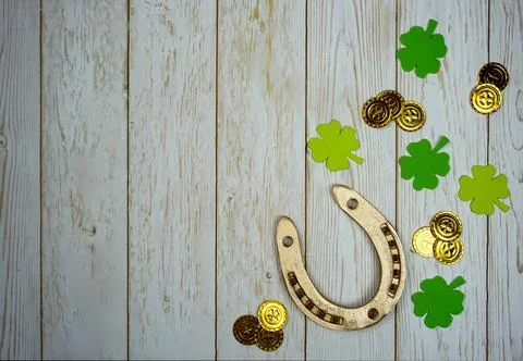 Items for St. Patrick's Day are laid out on a wooden background. Stock Photos