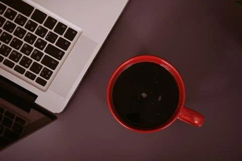 Items on the table. Studying and working with a laptop and a notebook. Stock Photos