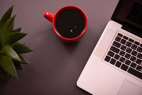 Items on the table. Studying and working with a laptop and a notebook. Stock Photos
