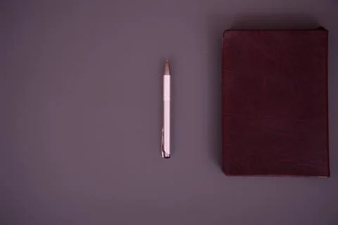 Items on the table. Studying and working with a laptop and a notebook. Stock Photos