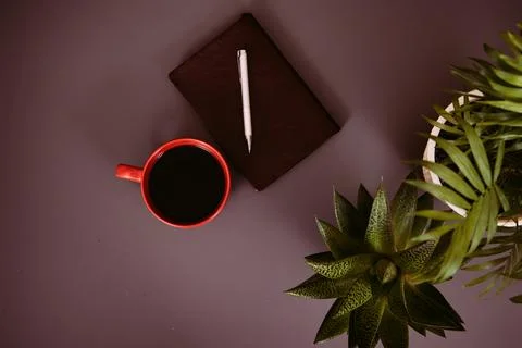 Items on the table. Studying and working with a laptop and a notebook. Stock Photos
