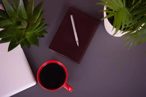 Items on the table. Studying and working with a laptop and a notebook. Stock Photos