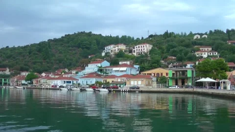 Ithaca, Frikes port, calm water surface with reflections of picturesque vill Stock Footage 315103953