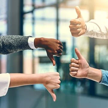 Its a 50-50 split. a group of unrecognizable businesspeople gesturing thumbs up Stock Photos