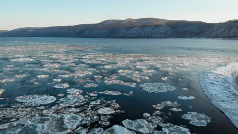 It's an aerial view. Spring ice move. The river has melted, but some ice floes Stock Footage 122171655