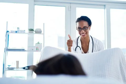 Its always a good idea to get checked. a young gynaecologist giving a thumbs up Stock Photos