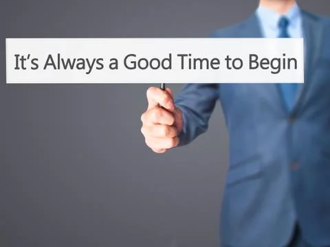 It's Always a Good Time to Begin - Businessman hand holding sign Stock Photos