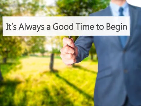 It's Always a Good Time to Begin - Businessman hand holding sign Stock Photos
