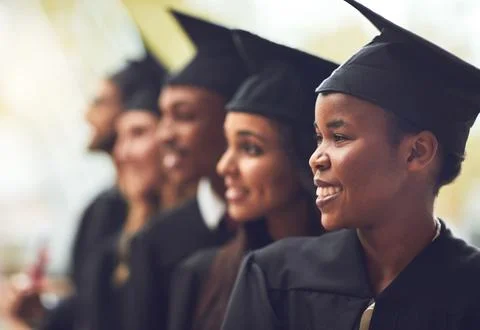 Its a bright future ahead of us. a group of fellow students standing in a row on Stock Photos