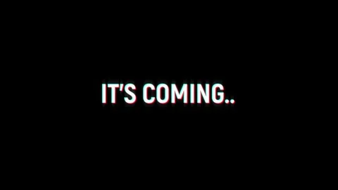 It's coming text notification glitch effect animation on black background Stock Footage 313439162