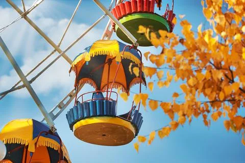 It's an empty Ferris wheel cab. Bottom-up view against the sky. Stock Photos