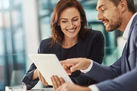 Its even better than I expected. two businesspeople meeting in the office. Foto stock