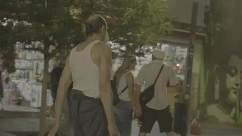 It's evening in Buenos Aires, Argentina, and there's a homeless man Stock Footage 345138230