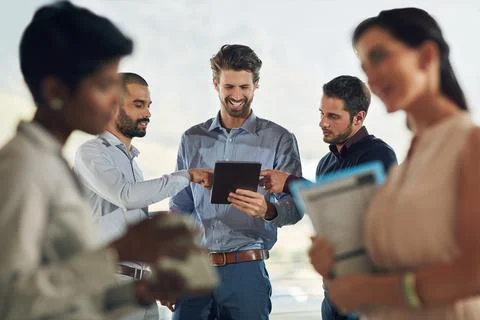 Its a functioning office. Cropped shot of a group of businesspeople standing Stock Photos