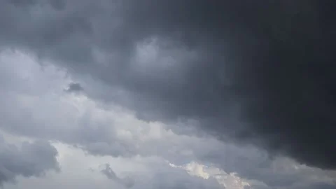 It's a gloomy day, gray rain clouds float across the dark sky, threatening rain. Stock Footage 220606280