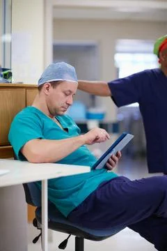 Its going to be a long shift. a doctor working in a hospital. Stock Photos