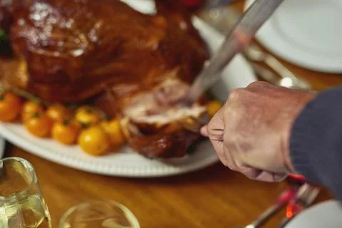 Its going to be one tasty meal. Closeup shot of a person cutting into a turkey Stock Photos