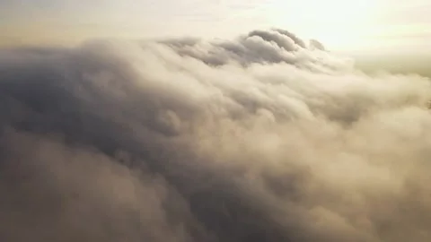 It's going through the clouds. The camera moves forward through thick smoke Stock Footage 147729877