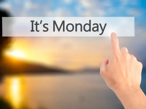 It's Monday - Hand pressing a button on blurred background concept . Business Stock Photos