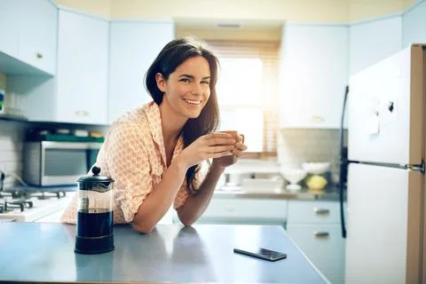 Its not chill time without coffee. an attractive young woman having a cup of Stock Photos