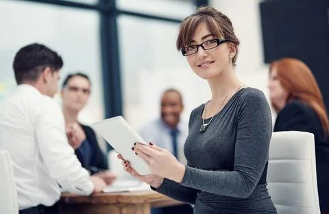 Its one way to drive efficiency into business. Portrait of a businesswoman using Stock Photos