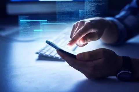 Its possible to code on any device. an unrecognizable male programmer at work. 库存照片