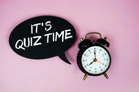 It's Quiz Time text on speech bubble with alarm clock on pink background Stock Photos