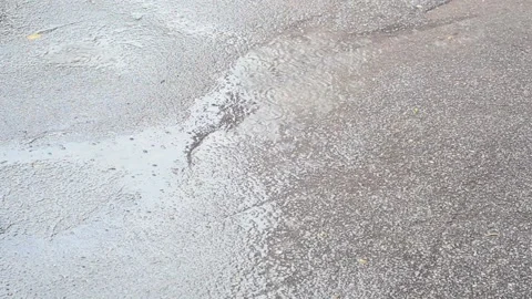 It's raining hard. Raindrops are falling on the asphalt Video stock 138401122