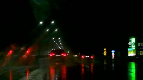 It's raining at night by car. Selective focus. Stock Footage 153619720