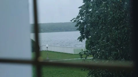 It's raining outside. View through the window of the lake. Bad weather 스톡 동영상 120491064